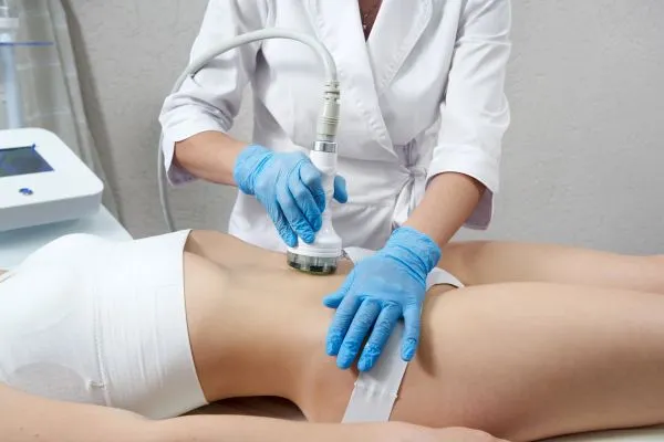 Lost the Weight but Not the Loose Skin? 2 woman having HIFU treatment on her stomach to combat loose skin Whitstable following weight loss